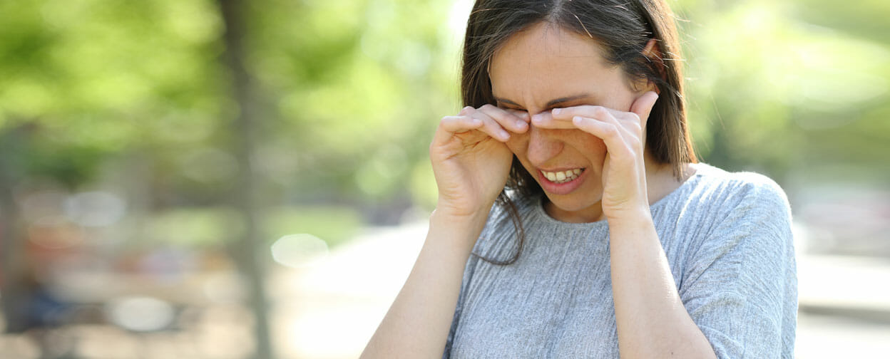 Photo of a woman rubbing her eyes