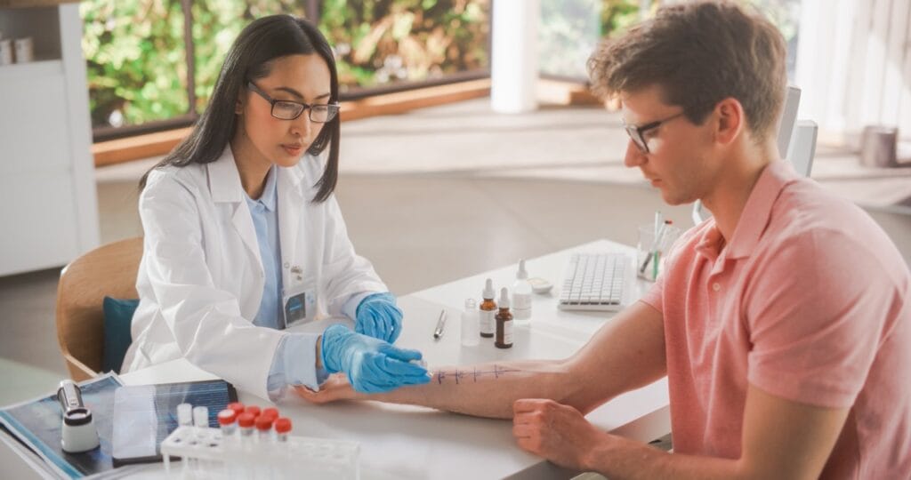Allergist performing skin prick allergy test