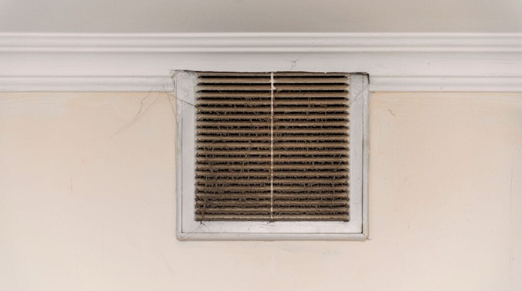 Dusty HVAC vent buildup triggering indoor allergies
