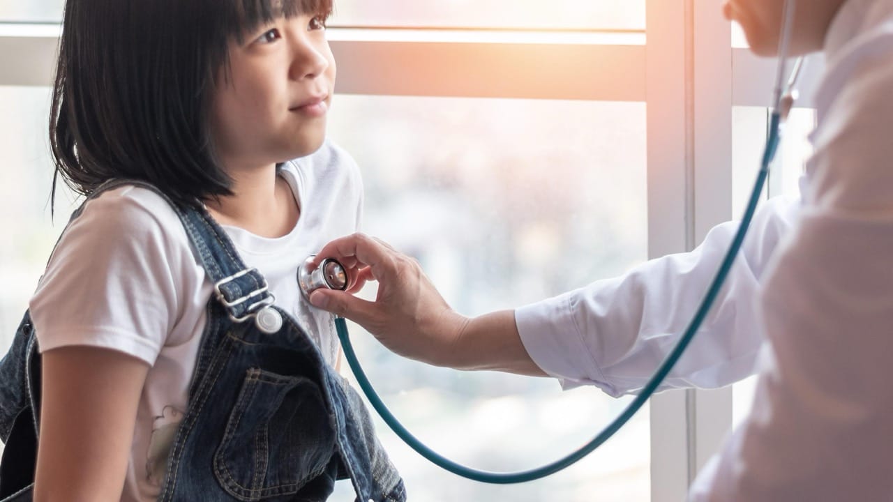 Woman experiencing smoke-related breathing discomfort